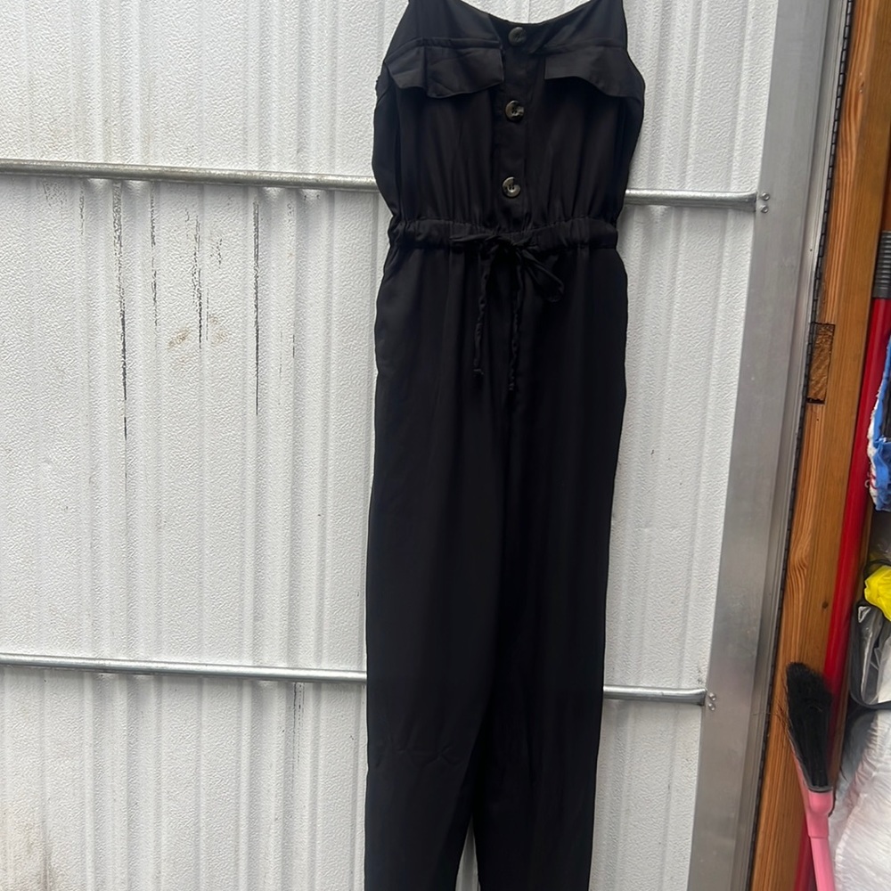 Black jumpsuit with pockets.Don’t recall original price.